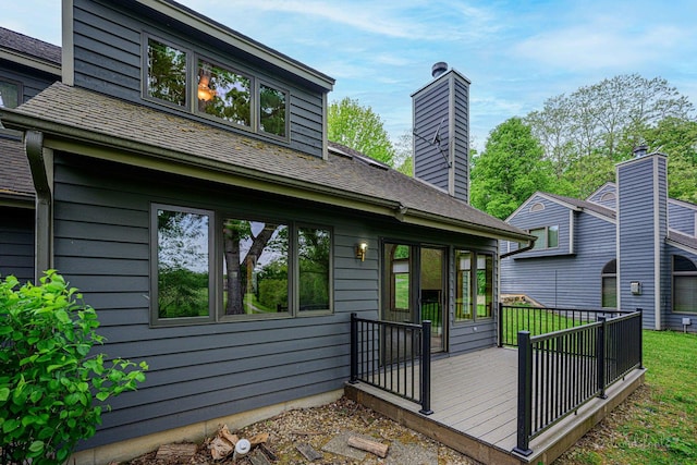 22 Valleywood Ln Unit 22, Galena, IL 61036 - rear view of property featuring a wooden deck and a chimney