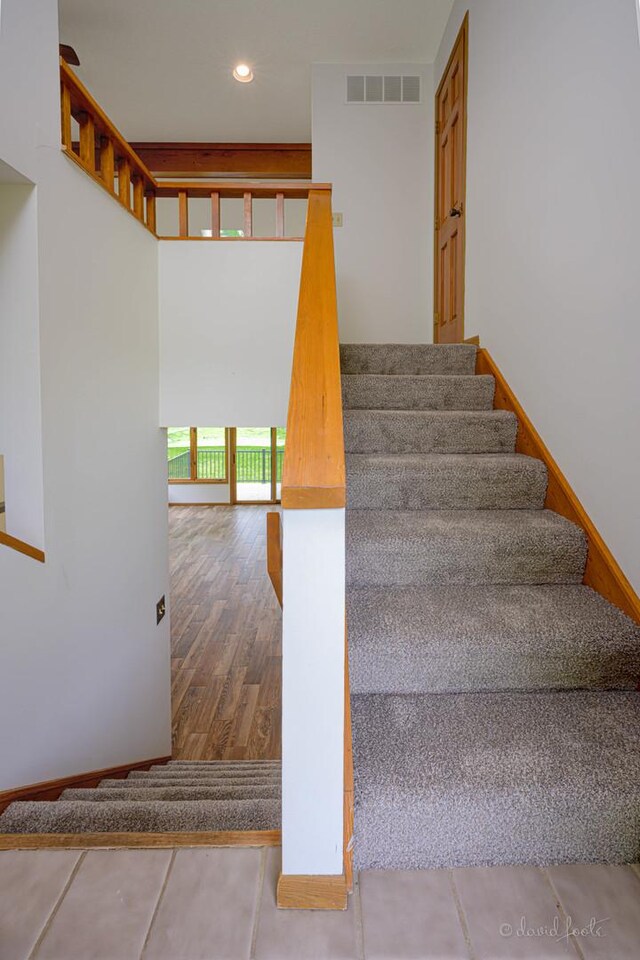 22 Valleywood Ln Unit 22, Galena, IL 61036 - staircase featuring recessed lighting, baseboards, and wood finished floors
