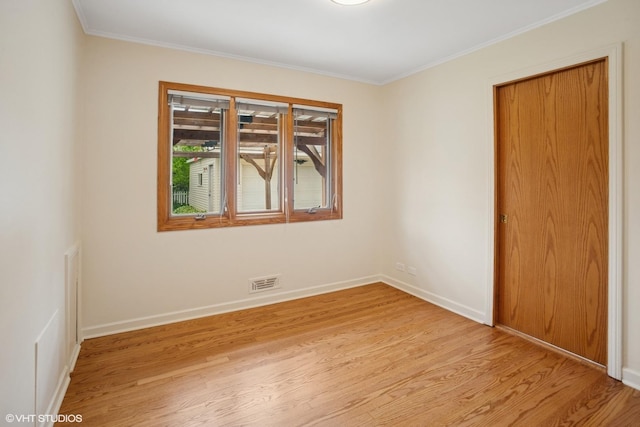 43 N Mount Prospect Rd, Des Plaines, IL 60016 - unfurnished room with light wood-style floors, crown molding, and baseboards