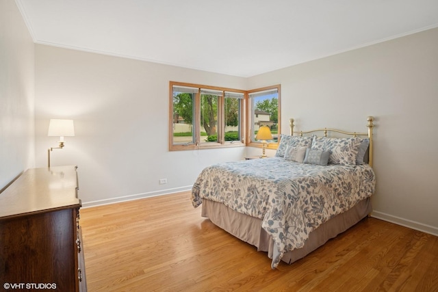 43 N Mount Prospect Rd, Des Plaines, IL 60016 - bedroom featuring baseboards, light wood finished floors, and crown molding