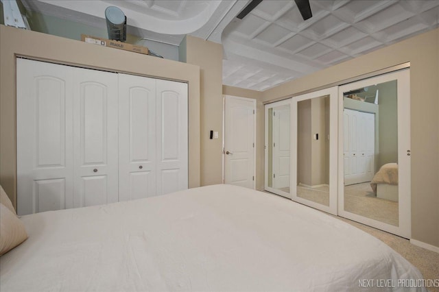 1307 S Wabash Ave Unit 402, Chicago, IL 60605 - carpeted bedroom featuring two closets, beam ceiling, coffered ceiling, and baseboards