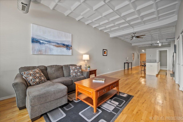 1307 S Wabash Ave Unit 402, Chicago, IL 60605 - living area featuring light wood-style floors, beamed ceiling, a ceiling fan, baseboards, and coffered ceiling
