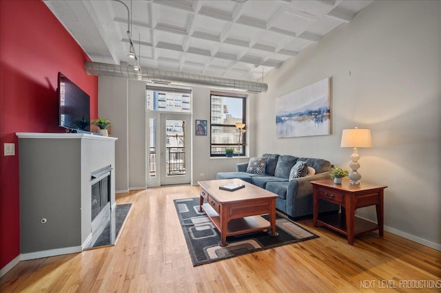 1307 S Wabash Ave Unit 402, Chicago, IL 60605 - living room with light wood-style flooring, baseboards, beam ceiling, and a fireplace