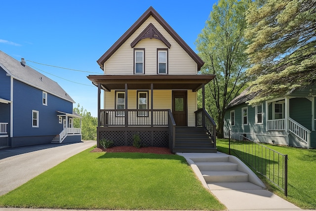 victorian-style house with covered porch and a front yard