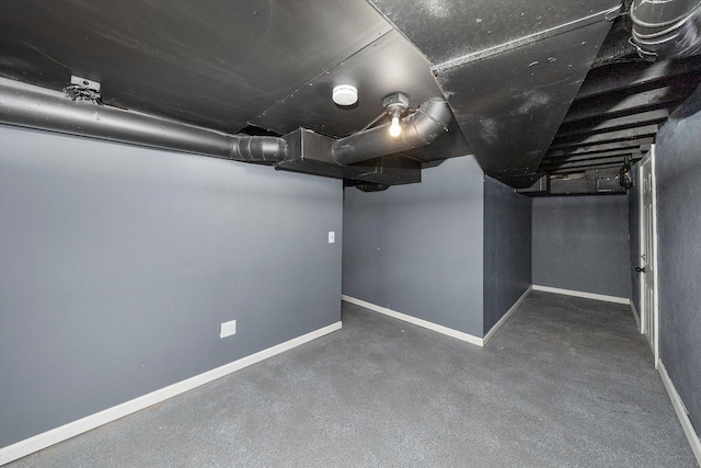 finished basement featuring baseboards