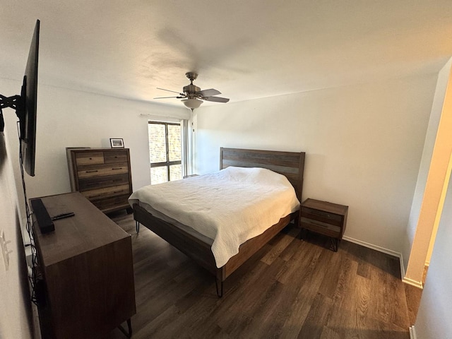 1919 Prairie Sq Unit 231, Schaumburg, IL 60173 - bedroom with dark wood finished floors, a ceiling fan, and baseboards