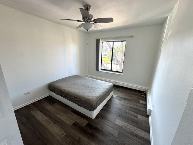 1919 Prairie Sq Unit 231, Schaumburg, IL 60173 - bedroom with a baseboard heating unit, wood finished floors, baseboards, and a ceiling fan