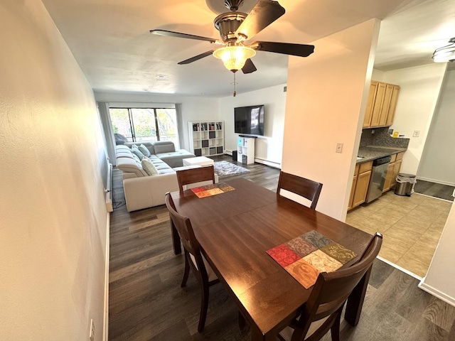 1919 Prairie Sq Unit 231, Schaumburg, IL 60173 - dining space with ceiling fan, baseboard heating, and wood finished floors