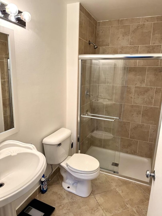 1919 Prairie Sq Unit 231, Schaumburg, IL 60173 - full bathroom with a shower stall, toilet, and a sink