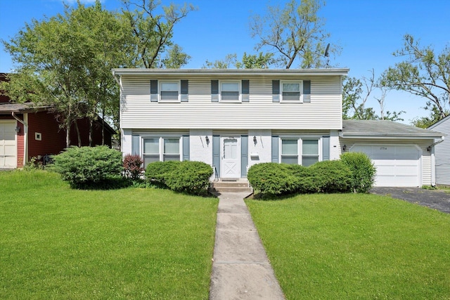 17714 Dogwood Ln, Hazel Crest, IL 60429 - colonial house with a garage, a front yard, and driveway