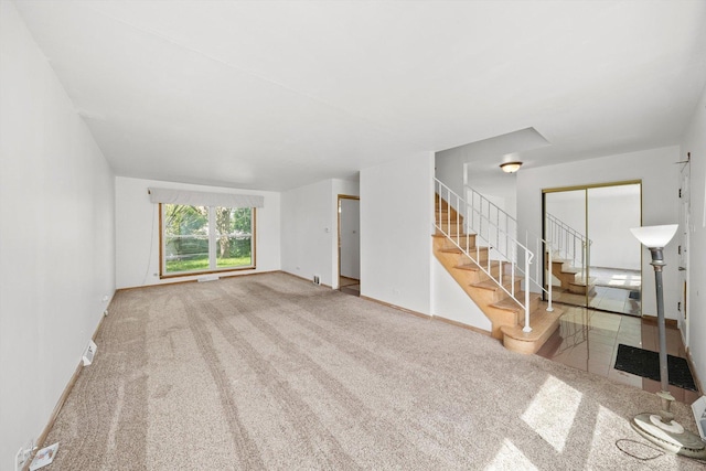 17714 Dogwood Ln, Hazel Crest, IL 60429 - unfurnished living room with carpet flooring, stairs, and baseboards