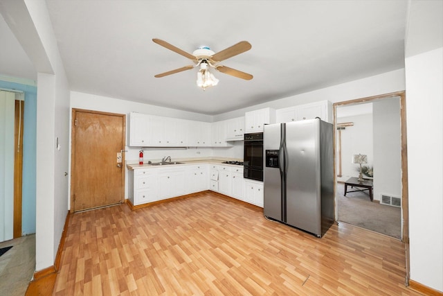 17714 Dogwood Ln, Hazel Crest, IL 60429 - kitchen featuring stainless steel refrigerator with ice dispenser, a sink, black oven, a ceiling fan, and a warming drawer
