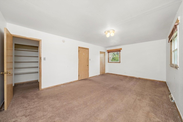 17714 Dogwood Ln, Hazel Crest, IL 60429 - unfurnished bedroom featuring carpet, a closet, and baseboards