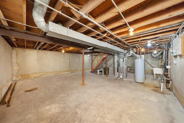 17714 Dogwood Ln, Hazel Crest, IL 60429 - unfinished below grade area with water heater, heating unit, stairs, a sink, and electric panel