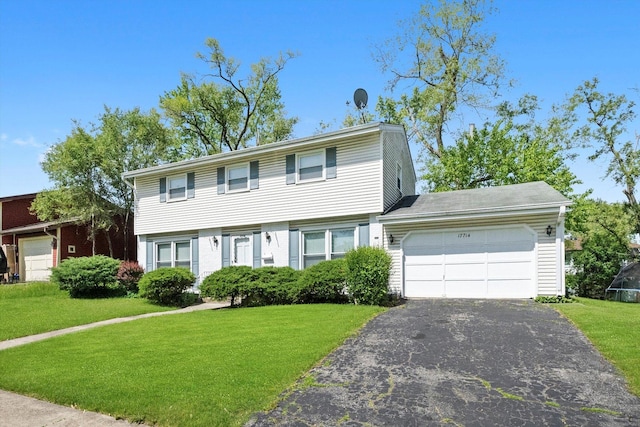 17714 Dogwood Ln, Hazel Crest, IL 60429 - colonial inspired home featuring driveway, an attached garage, and a front lawn