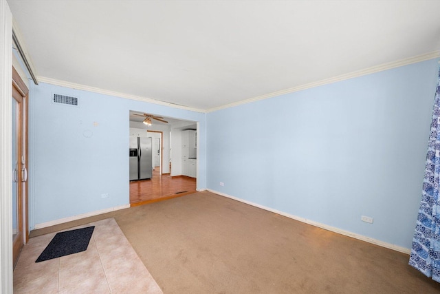 17714 Dogwood Ln, Hazel Crest, IL 60429 - unfurnished room with ornamental molding, baseboards, carpet flooring, and a ceiling fan