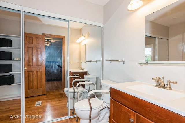 3724 Monitor Dr, Hanover Park, IL 60133 - full bath with toilet, wood finished floors, and vanity