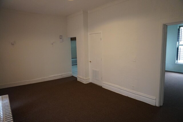 7225 S Princeton Ave, Chicago, IL 60621 - spare room with dark colored carpet and baseboards