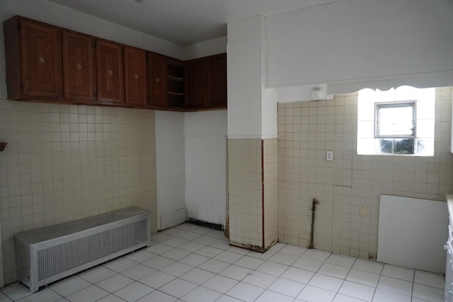 7225 S Princeton Ave, Chicago, IL 60621 - interior space with tile walls, radiator heating unit, and tile patterned flooring