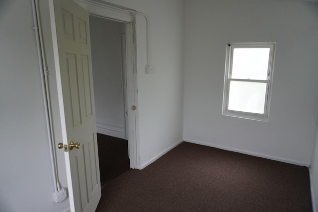 7225 S Princeton Ave, Chicago, IL 60621 - empty room featuring dark carpet and baseboards