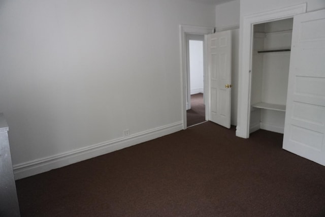 7225 S Princeton Ave, Chicago, IL 60621 - unfurnished bedroom featuring dark carpet and a closet