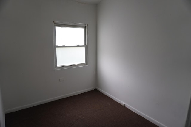 7225 S Princeton Ave, Chicago, IL 60621 - unfurnished room featuring dark carpet and baseboards