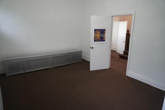7225 S Princeton Ave, Chicago, IL 60621 - spare room with dark carpet and baseboards