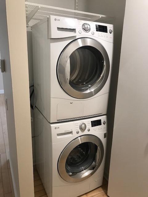 680 N Lake Shore Dr Unit 1623, Chicago, IL 60611 - laundry room featuring stacked washer and clothes dryer