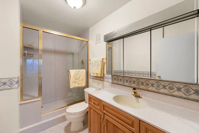 1615 E Central Rd Unit 410B, Arlington Heights, IL 60005 - bathroom with a shower stall, vanity, toilet, and decorative backsplash