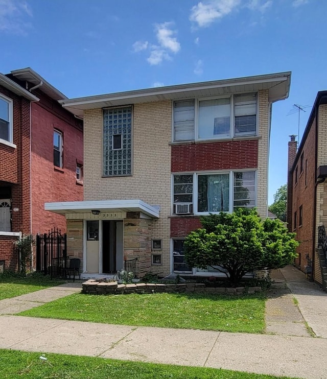 3355 W 65th St, Chicago, IL 60629 - view of front of house featuring brick siding and cooling unit
