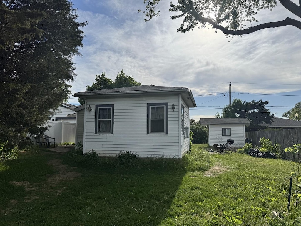 view of home's exterior featuring an outdoor structure