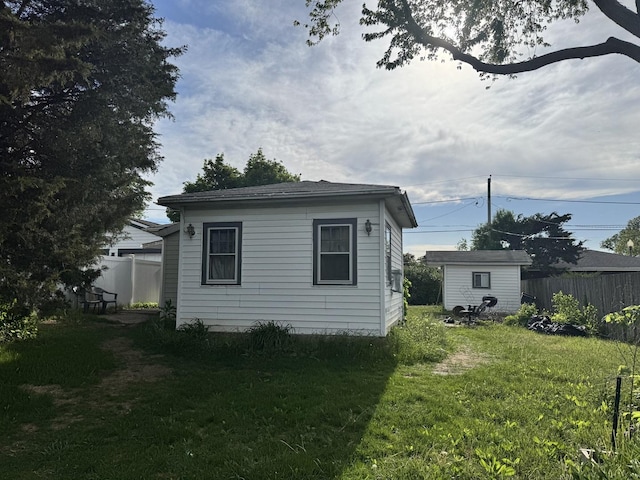 view of home's exterior featuring an outdoor structure