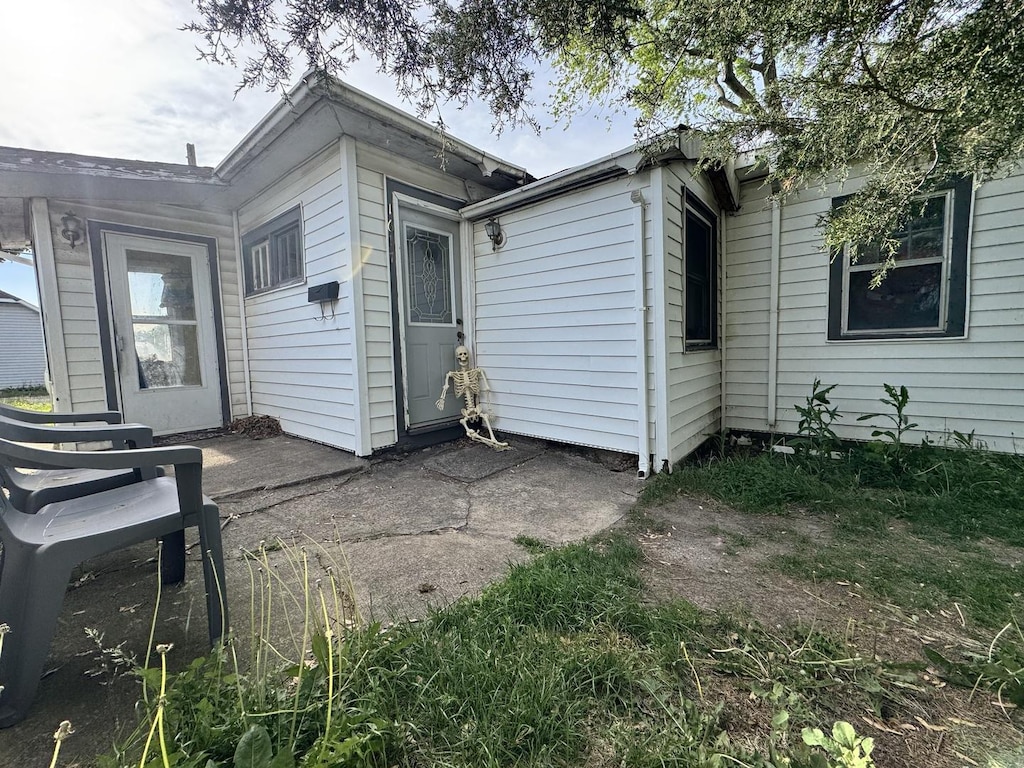 back of house with a patio