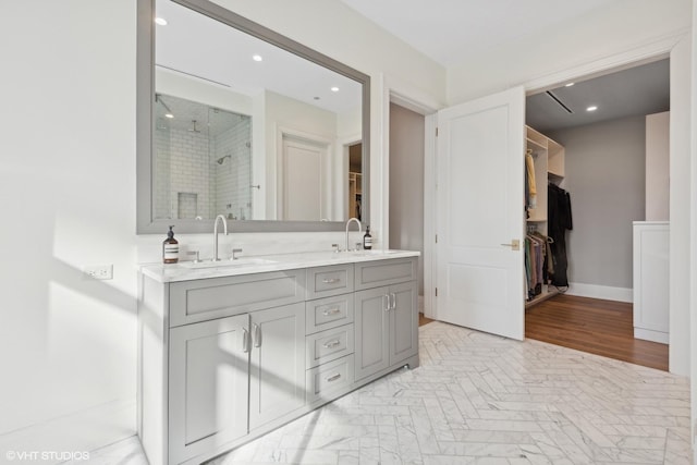 1109 W Washington Blvd Unit 2B, Chicago, IL 60607 - full bath featuring recessed lighting, a stall shower, a spacious closet, double vanity, and baseboards