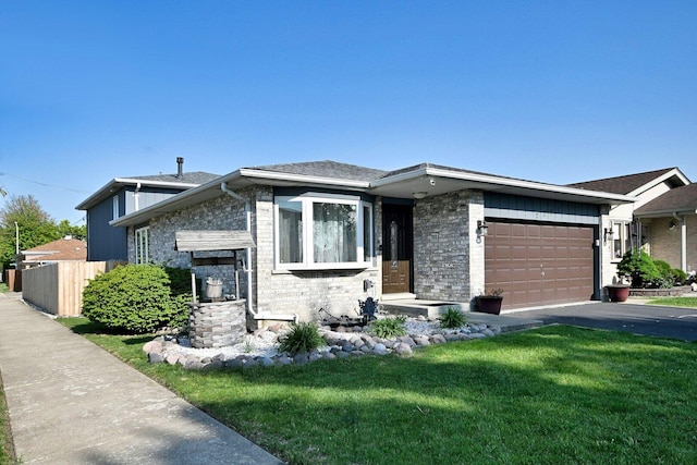 7701 New Castle Ave, Burbank, IL 60459 - tri-level home with brick siding, an attached garage, and driveway