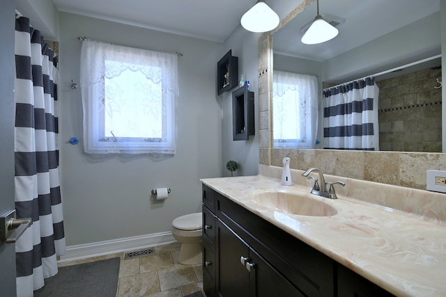 7701 New Castle Ave, Burbank, IL 60459 - bathroom with vanity, toilet, baseboards, stone finish flooring, and a shower with curtain