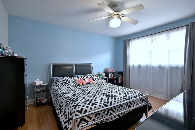 7701 New Castle Ave, Burbank, IL 60459 - bedroom featuring wood finished floors, ceiling fan, and baseboards
