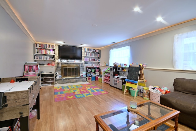 7701 New Castle Ave, Burbank, IL 60459 - living room with ornamental molding, wood finished floors, and a fireplace