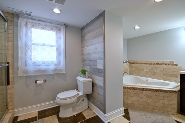 7701 New Castle Ave, Burbank, IL 60459 - bathroom with toilet, a whirlpool tub, a tile shower, and recessed lighting