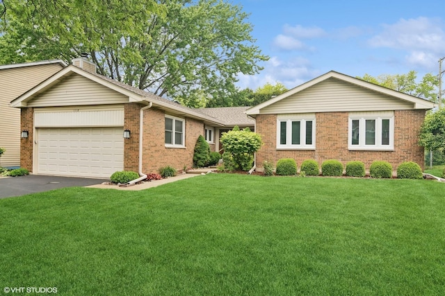 1118 W Keating Dr, Arlington Heights, IL 60005 - single story home featuring an attached garage, brick siding, asphalt driveway, a chimney, and a front lawn
