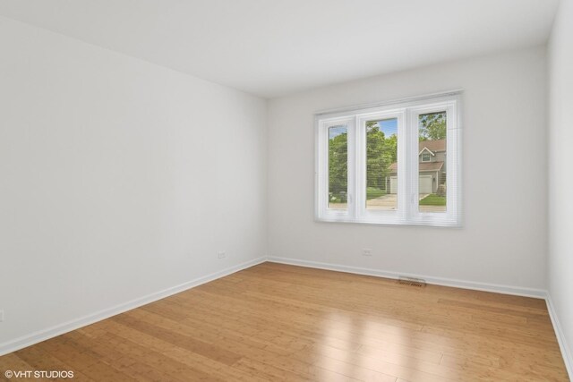 1118 W Keating Dr, Arlington Heights, IL 60005 - spare room with light wood finished floors and baseboards