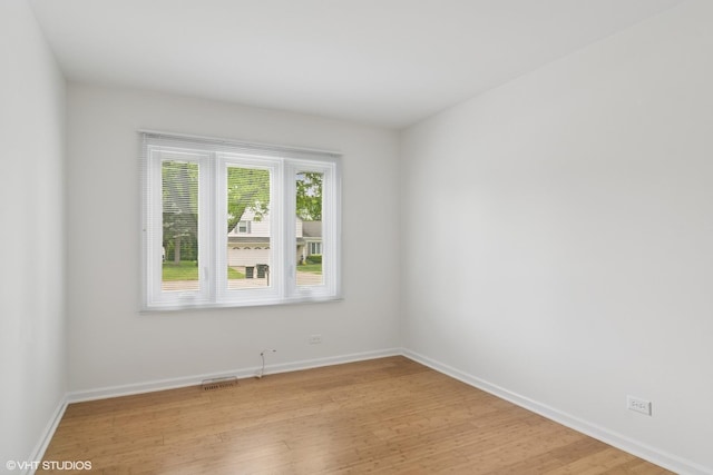 1118 W Keating Dr, Arlington Heights, IL 60005 - empty room featuring light wood-style floors and baseboards