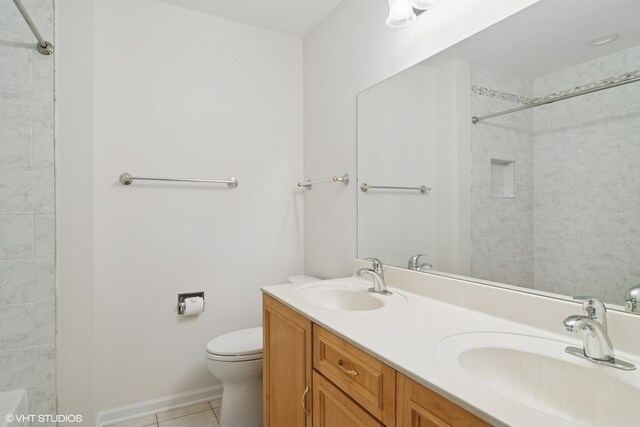 1118 W Keating Dr, Arlington Heights, IL 60005 - bathroom with tile patterned floors, double vanity, toilet, a shower, and baseboards
