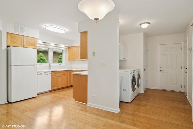1118 W Keating Dr, Arlington Heights, IL 60005 - kitchen featuring white appliances, washing machine and dryer, light wood-style flooring, light countertops, and baseboards