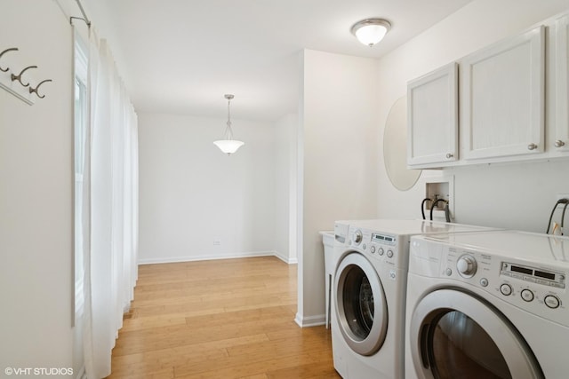 1118 W Keating Dr, Arlington Heights, IL 60005 - laundry room featuring separate washer and dryer, light wood-type flooring, cabinet space, and baseboards