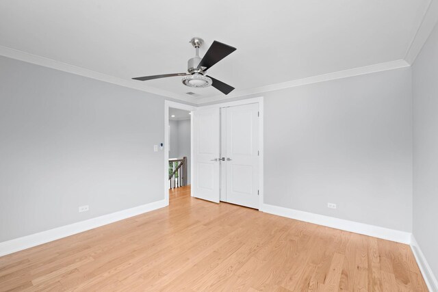 44 Cranbrook Dr, Des Plaines, IL 60016 - spare room featuring baseboards, a ceiling fan, crown molding, and light wood-style floors