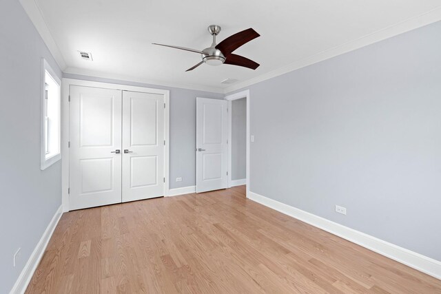 44 Cranbrook Dr, Des Plaines, IL 60016 - unfurnished bedroom featuring light wood-type flooring, a closet, baseboards, crown molding, and ceiling fan