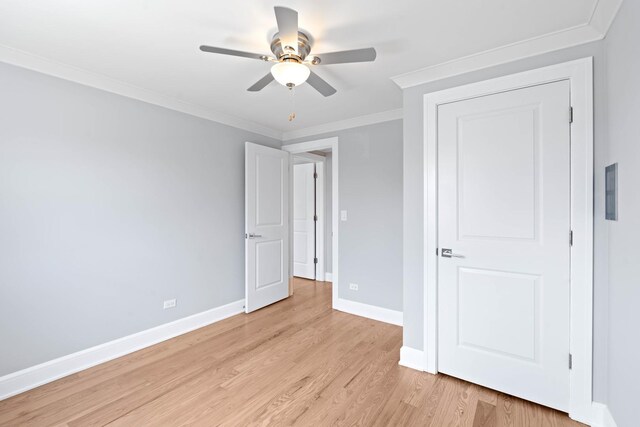 44 Cranbrook Dr, Des Plaines, IL 60016 - unfurnished bedroom with baseboards, light wood finished floors, crown molding, and a ceiling fan