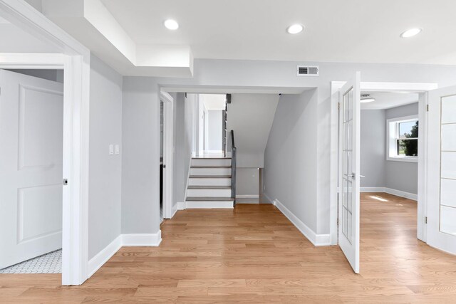 44 Cranbrook Dr, Des Plaines, IL 60016 - corridor featuring baseboards, light wood finished floors, stairs, recessed lighting, and french doors