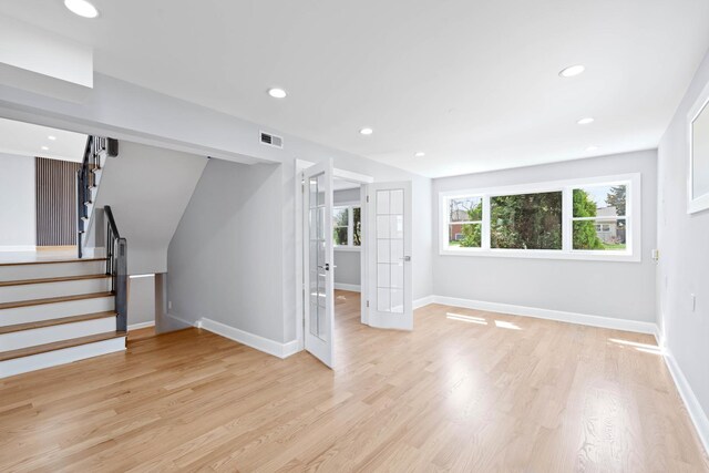 44 Cranbrook Dr, Des Plaines, IL 60016 - unfurnished living room with stairway, light wood finished floors, baseboards, and recessed lighting